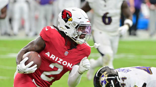 Oct 29, 2023; Glendale, Arizona, USA; Arizona Cardinals wide receiver Marquise Brown (2) runs with the ball as Baltimore Ravens cornerback Marlon Humphrey (44) defends in the first half at State Farm Stadium. Mandatory Credit: Matt Kartozian-USA TODAY Sports  